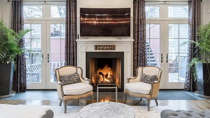 High-End Home Interior Financed with a Bank Statement Mortgage – Qualify Without Tax Returns | Nonqmfunds.com Luxury living room with fireplace and elegant seating, showcasing a property financed through a bank statement mortgage